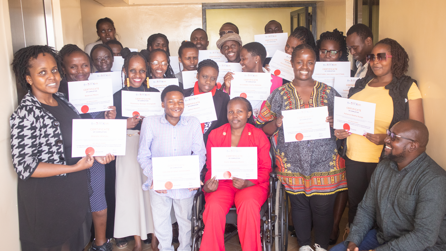 Young people with diverse disabilities celebrate their AWS Solutions Architect graduation, smiling and holding up certificates. 